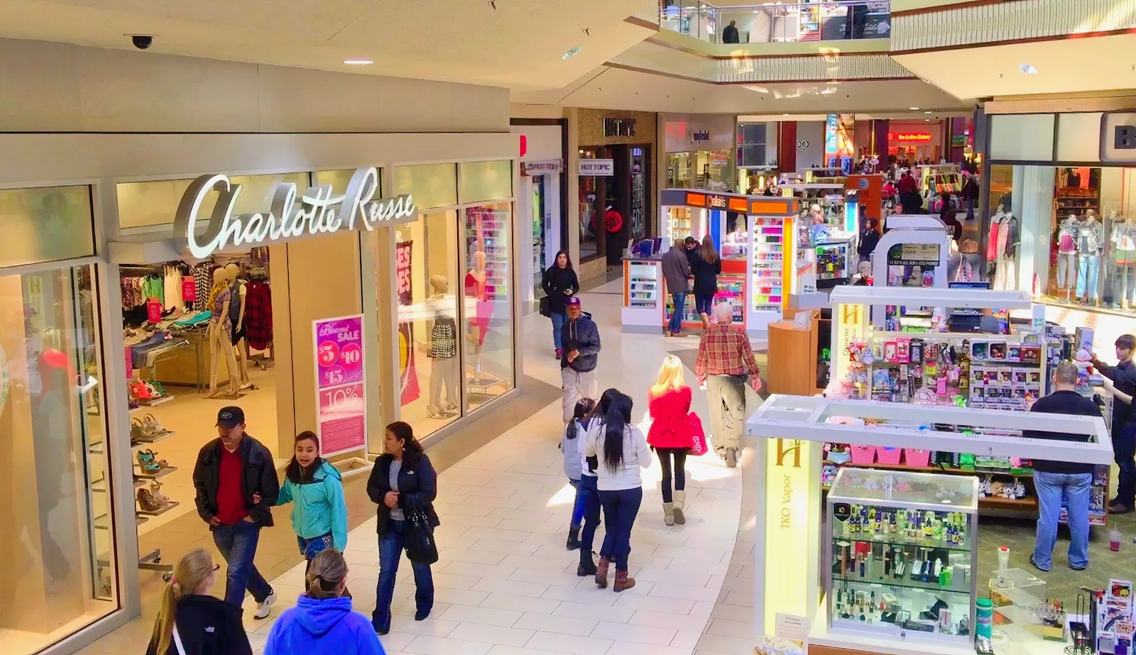 Shoppers walk past stores and kiosks inside Hamilton Place mall in Chattanooga.