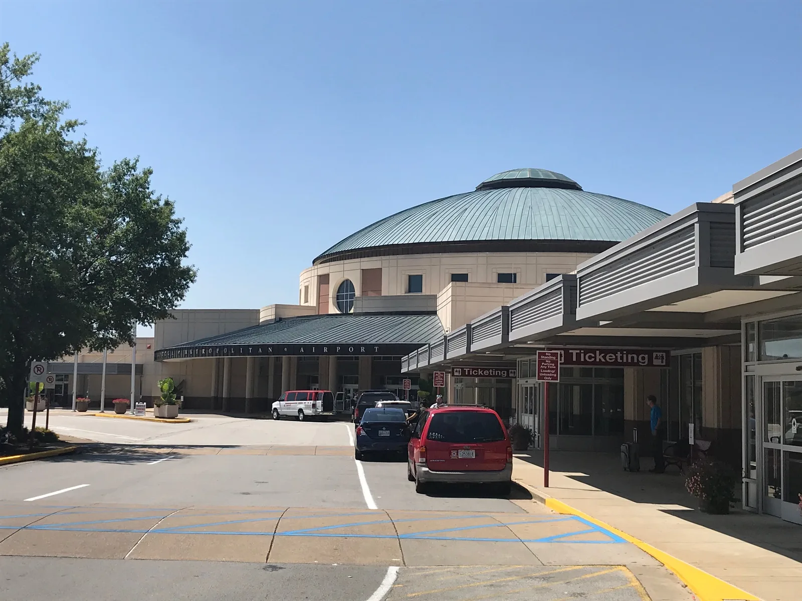 The front entrance and domed terminal of Chattanooga Metropolitan Airport, seen from the parking area.