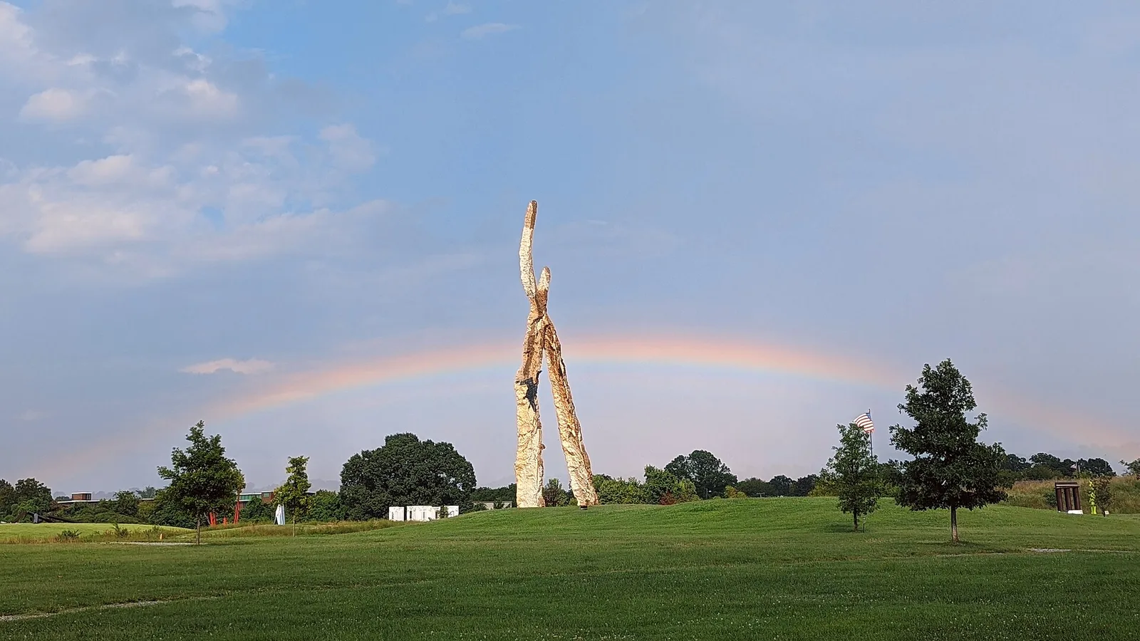 A rainbow over the towering sculpture Anchors at Sculpture Fields at Montague Park in Chattanooga.
