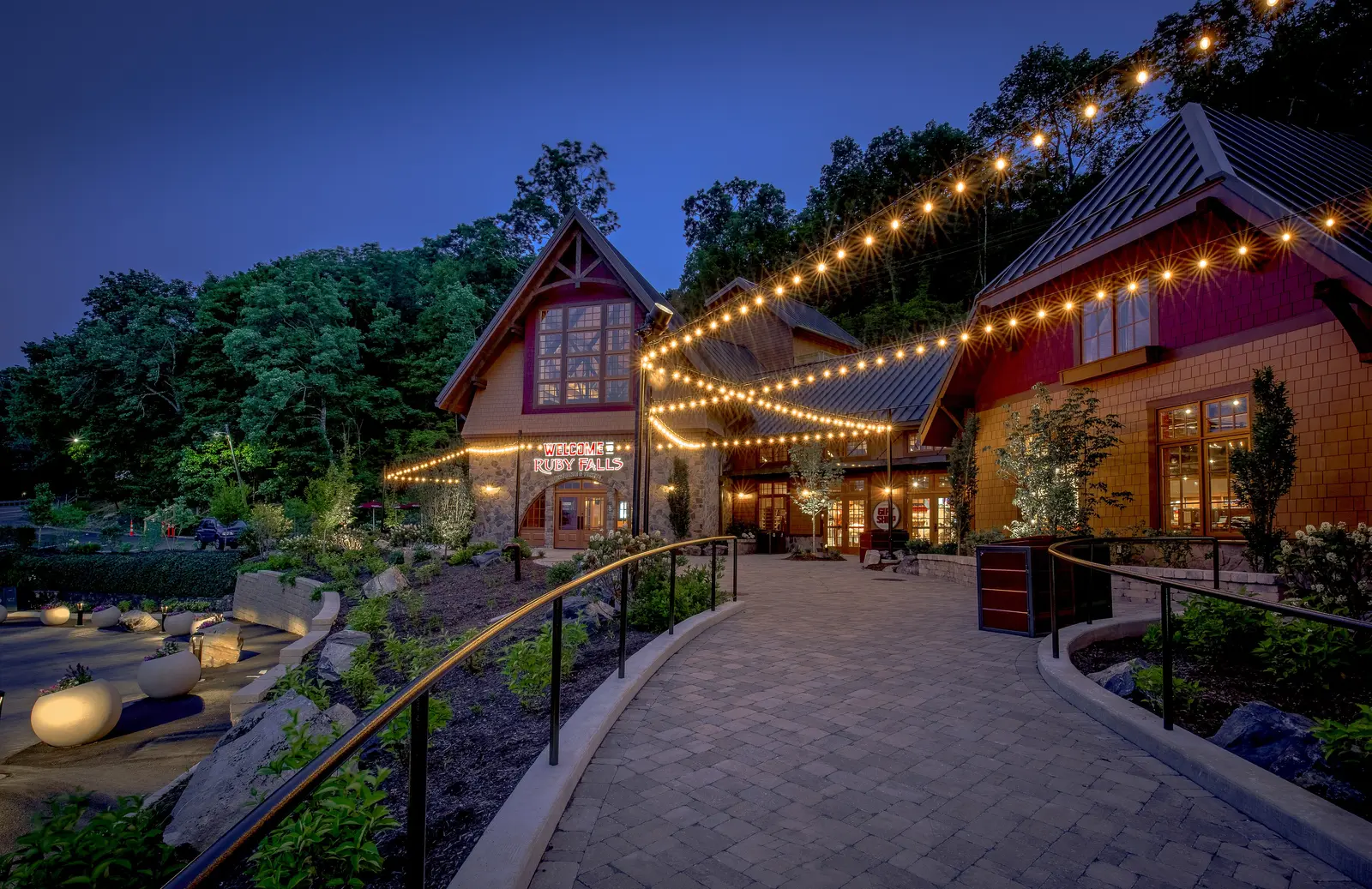 The entrance plaza at Ruby Falls on Lookout Mountain, lit at night.