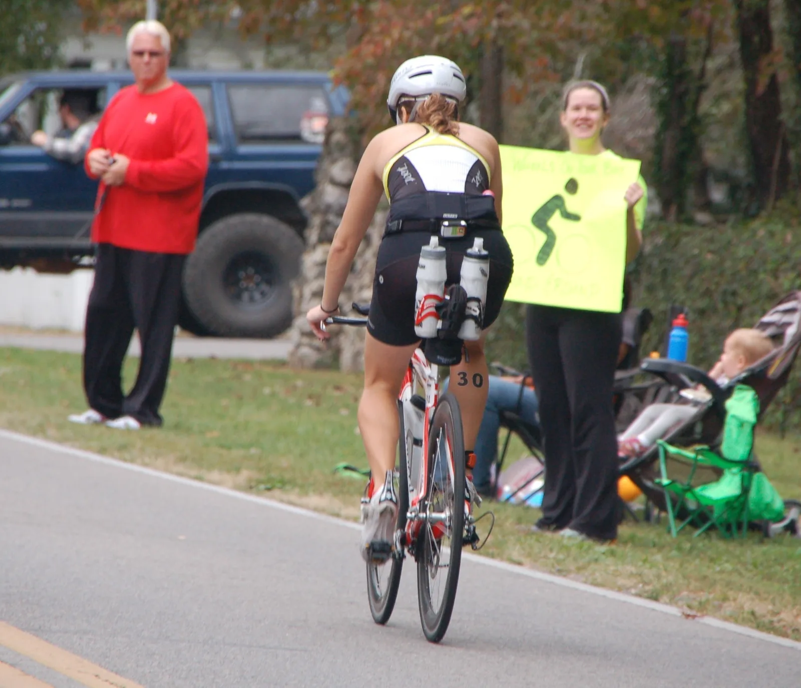 A cyclist passes spectators on the bike course of IRONMAN Chattanooga in September 2014.