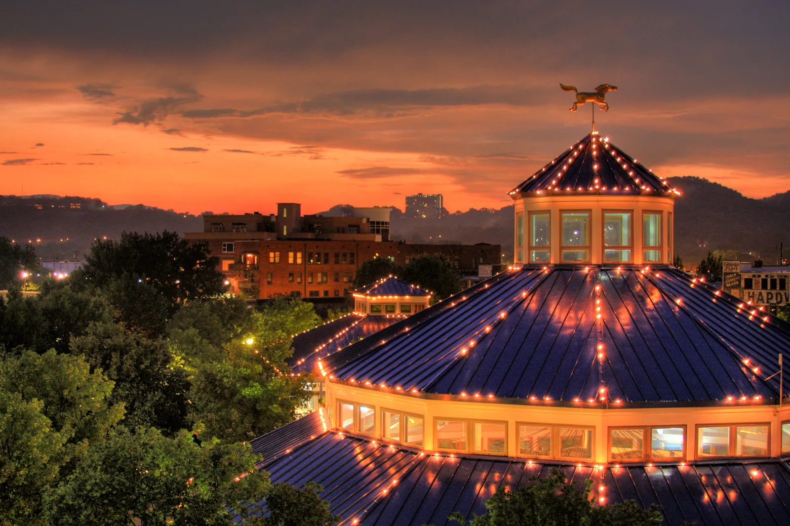 The lighted roof of the carousel pavilion at Coolidge Park on Chattanooga's North Shore at dusk.