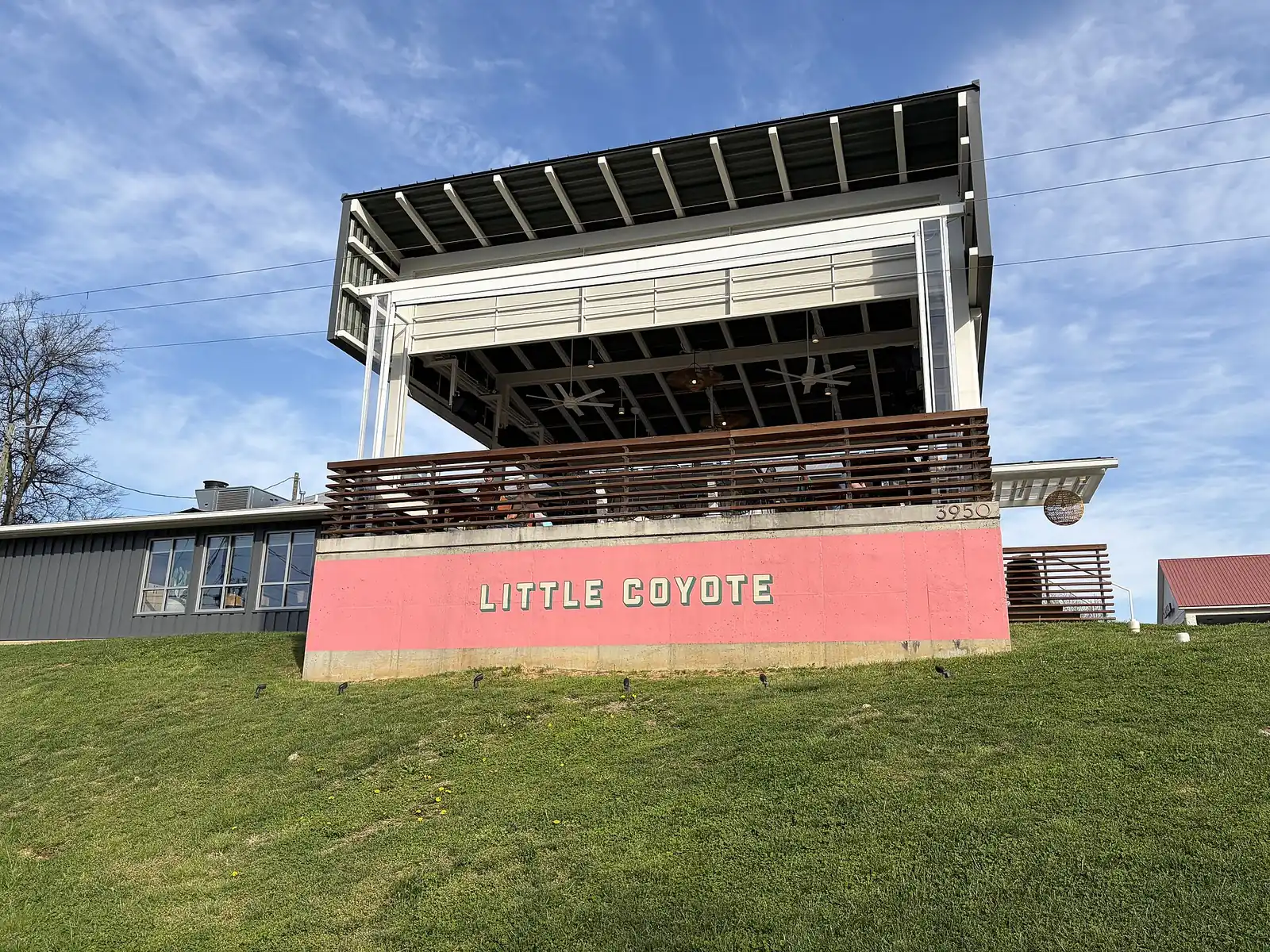 The covered patio at Little Coyote, 3950 Tennessee Ave. in St. Elmo, seen from the lawn below.