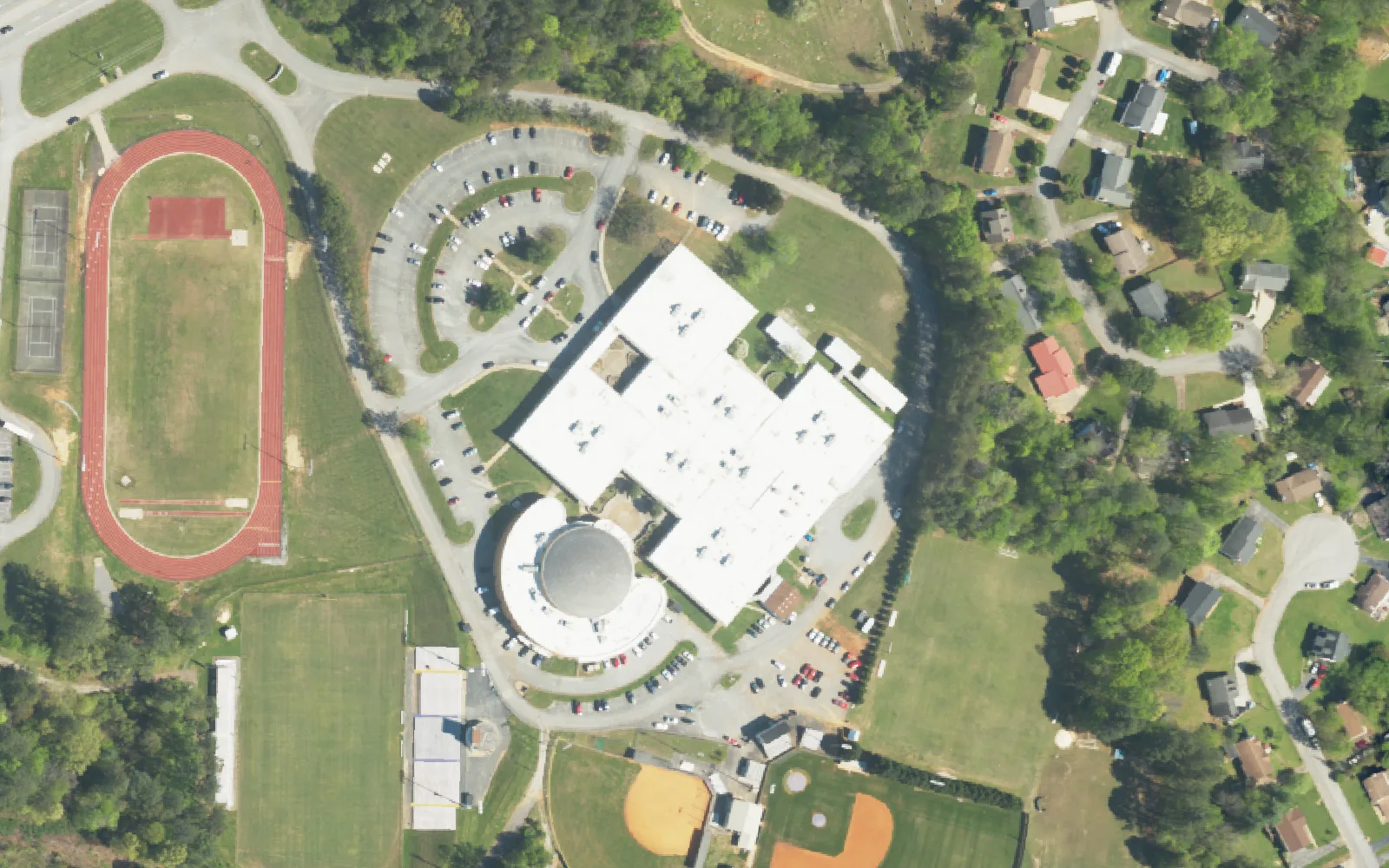 Central High School's campus on Highway 58, with its track and ball fields, seen from the air.