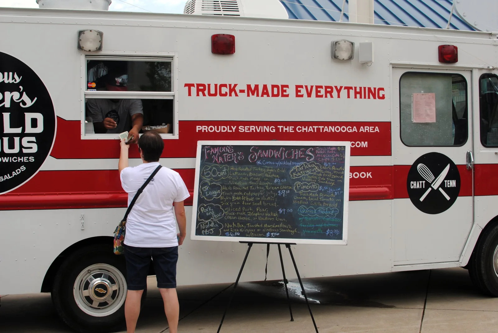 A customer orders at a sandwich truck that serves the Chattanooga area.